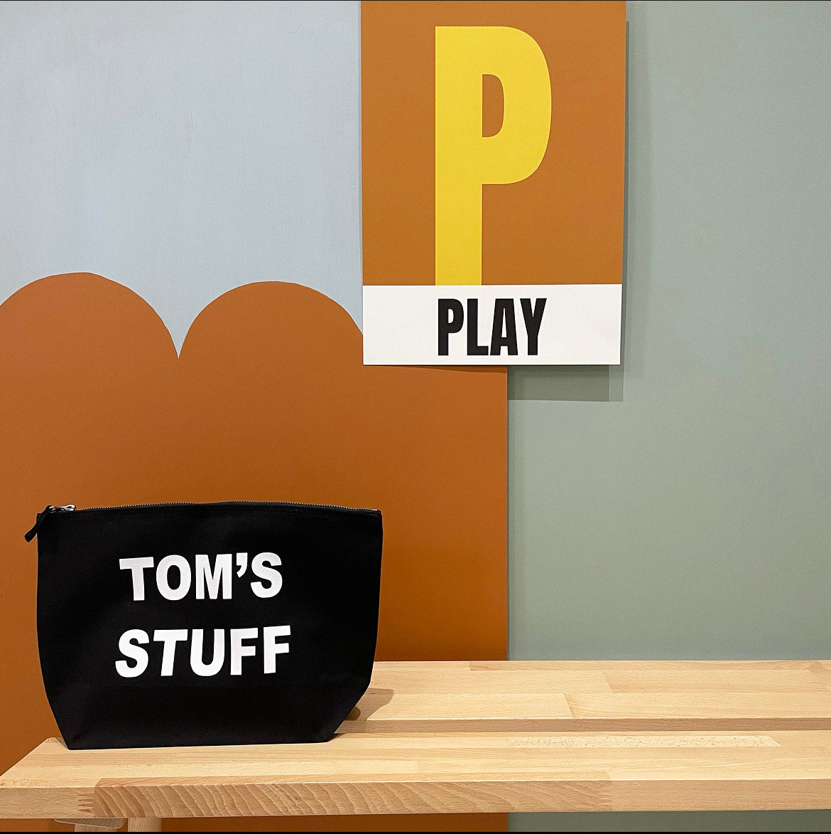 Black recycled canvas pouch personalised with STUFF wording, flat view